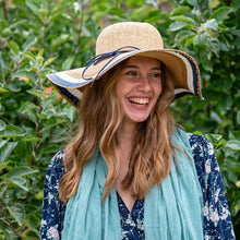 Load image into Gallery viewer, WIDE BRIMMED STRAW HAT WITH NAVY AND WHITE STRIPES
