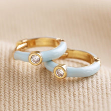 Load image into Gallery viewer, Baby Blue Enamel Crystal Huggie Hoop Earrings in Gold
